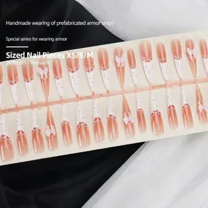Handmade long pointed press-on nails with lace French tips and pink 3D ribbon bows