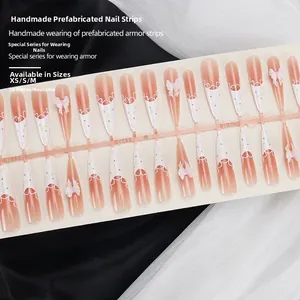 Handmade long pointed press-on nails with lace French tips and pink 3D ribbon bows