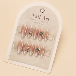 Long trapezoid press-on nails with cat eye gradient and shimmering rhinestones