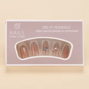 Macro view of gradient cat-eye press-on nails set with rhinestones in 30pcs box packaging