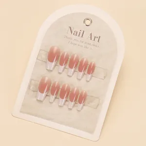 Elegant long coffin press-on nails with pink base and classic white French tips on card