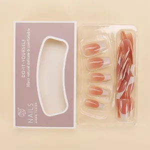 Detail of 30-piece gradient French press-on nail kit with purple packaging box