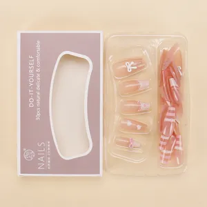 Pink French press-on nail kit with hearts, bows, and rhinestones in 30pcs set