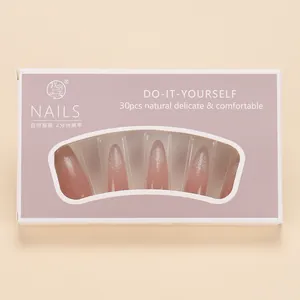 Detail of almond-shaped cat eye press-on nails with pink gradient and silver glitter