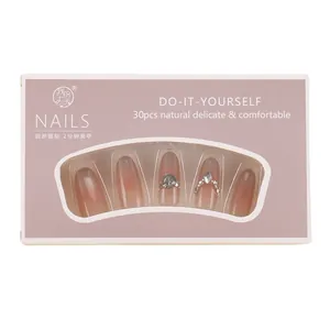 30-piece press-on nail kit featuring pink gradient cat-eye design with rhinestones