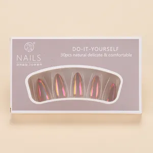 Detail of 30pcs holographic pink and gold gradient press-on nails in box packaging