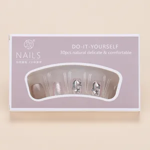 Pink cat eye press-on nails with 30 pieces featuring silver stars and bow charms