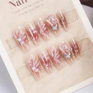 Press-on gradient nails with 3D butterfly, pearls and floral accents in coffin shape