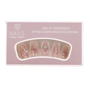 Pink gradient press-on nails set with 3D butterfly, pearls, and floral art designs