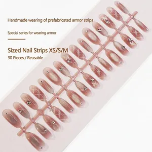 Handmade press-on nails with cat-eye effect, rhinestone accents and white plaid patterns