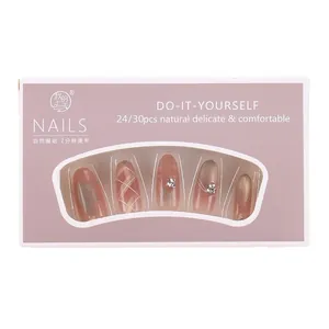 Cat eye press-on nails set with rhinestones and silver glitter in a pink gift box