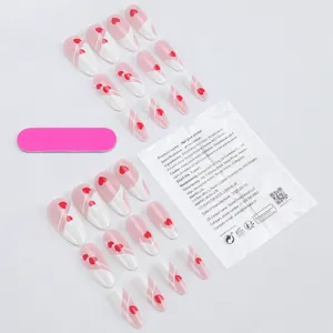 French tip press-on nails set with heart patterns, including pink file and adhesive tabs