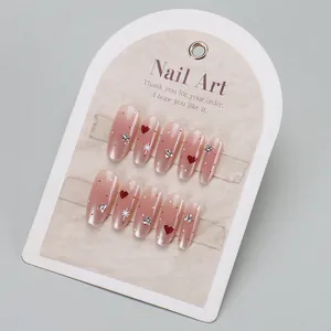 Pink gradient press-on nails with red hearts and rhinestones for women manicures