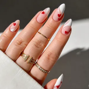 Almond-shaped French press-on nails with red heart patterns and white tips, 24 pieces set