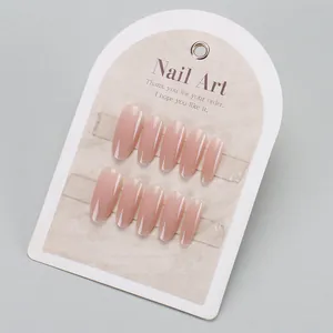 Long almond press-on nails with nude pink gradient and silver glitter french tips