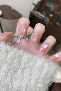 Detail of S925 sterling silver beaded ring with white pearl on finger