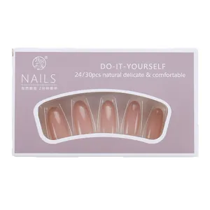 Elegant French press-on nails with golden glitter gradient in minimalist purple packaging