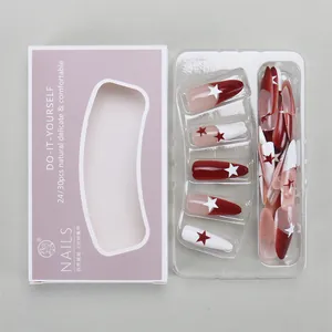 Macro view of 24pcs long coffin press-on nails with red white stars and purple box