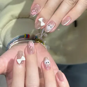 Faux ongles œil de chat rose avec nœuds 3D et motifs de pattes de chat adorables