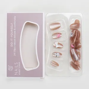 Faux ongles œil-de-chat faits main avec motifs chat et nœud en emballage violet