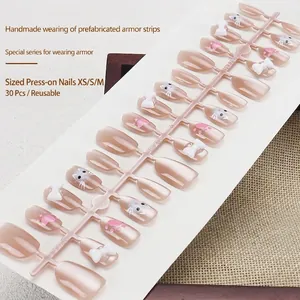 Faux ongles faits main avec motifs de pattes de chat 3D et nœuds en tons rose nude