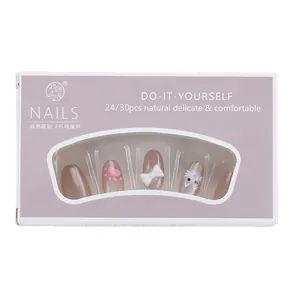 Faux ongles œil de chat rose avec motifs lapin et nœud dans une boîte mauve
