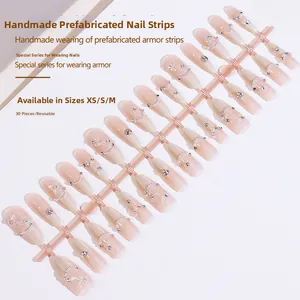 Detailed set of 30 handmade press-on nails featuring butterfly pearls and cat-eye stones