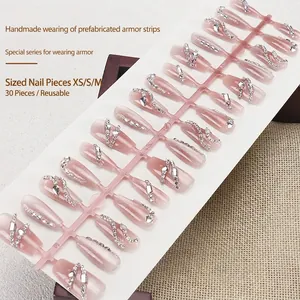 Handmade cat eye press-on nails set with pink gradient and luxury rhinestone accents