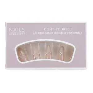 Pink stiletto press-on nails set with elegant pearls and sparkling rhinestones