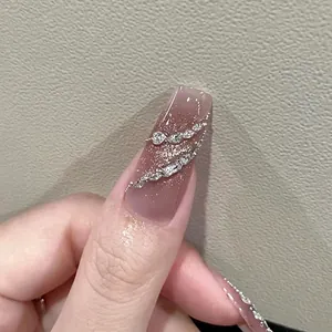 Cat eye gradient press-on nails with silver glitter, rhinestones, and chain details