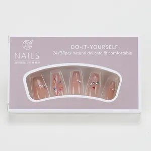 Detailed view of champagne glitter cat-eye press-on nails with rhinestones and pearls