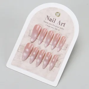 Long almond press-on nails in nude cat-eye shimmer finish with a handmade luxury look
