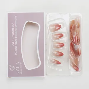 Detail of pink gradient cat-eye press-on nails in purple translucent gift packaging