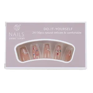 Cat eye press-on nails with fireworks rhinestone design and natural pink floral patterns