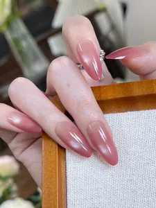 Detailed view of long almond cat-eye press-on nails with pink purple gradient finish