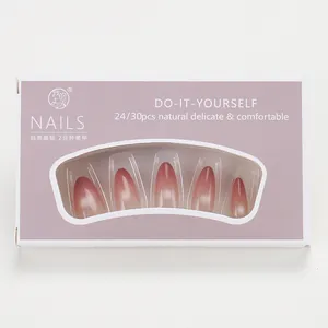 Macro detail of almond gradient cat-eye press-on nails in light purple gift box packaging