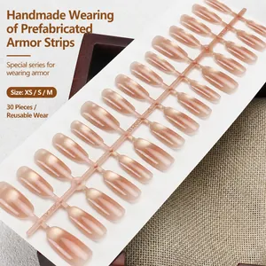 Handmade pearlescent cat-eye almond press-on nails in elegant nude pink gradient