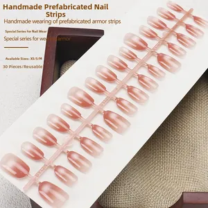Detail of 30-piece cat eye gradient press-on nail set in XS S M sizes on display board
