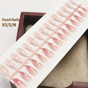 Pink gradient cat eye press-on nail set with 30 pieces on a transparent display stand