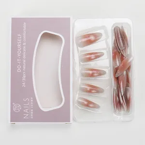 Detail of pink glitter gradient stiletto press-on nails in branded window gift box