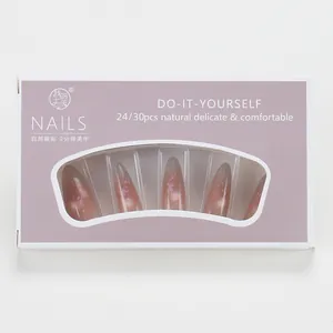 Detail of pink-purple gradient almond press-on nails with glitter in lilac gift box