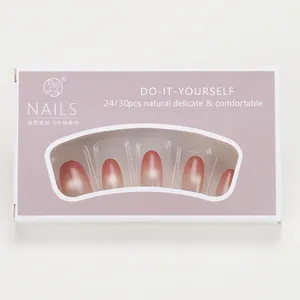 Pink cat eye gradient press-on nails in purple display box with oval shape finish