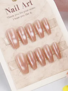 Detailed view of nude mauve cat-eye press-on nails in long ballerina shape set