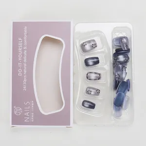 Detailed set of grey-purple cat-eye press-on nails with floral art in premium packaging
