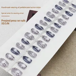 Handmade gradient blue cat eye press-on nails with floral rhinestone accents, 30 pieces