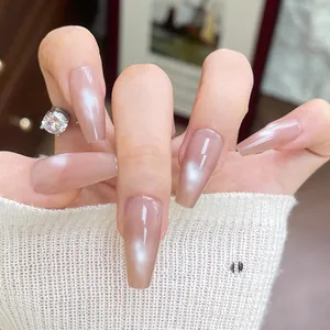 Elegant long coffin nude cat-eye press-on nails with pearl luster on model hand