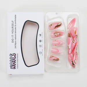 French pink gradient press-on nails with gold fluid metallic accents and pearls