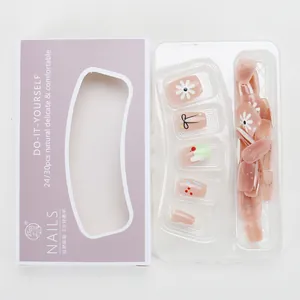 Short trapezoid press-on nails with sweet pink daisy and bow patterns for summer style