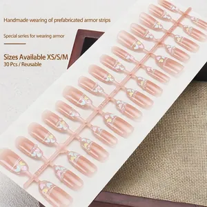 Handmade press-on nails with nude pink gradient, colorful hearts and pearl accents, 30pcs