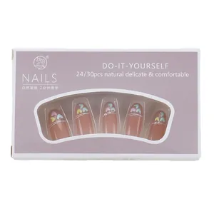 Press-on nail set with French heart and pearl accents in pink packaging box
